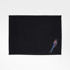 Black embroidered  Tablemat with bird embroidery on a white background