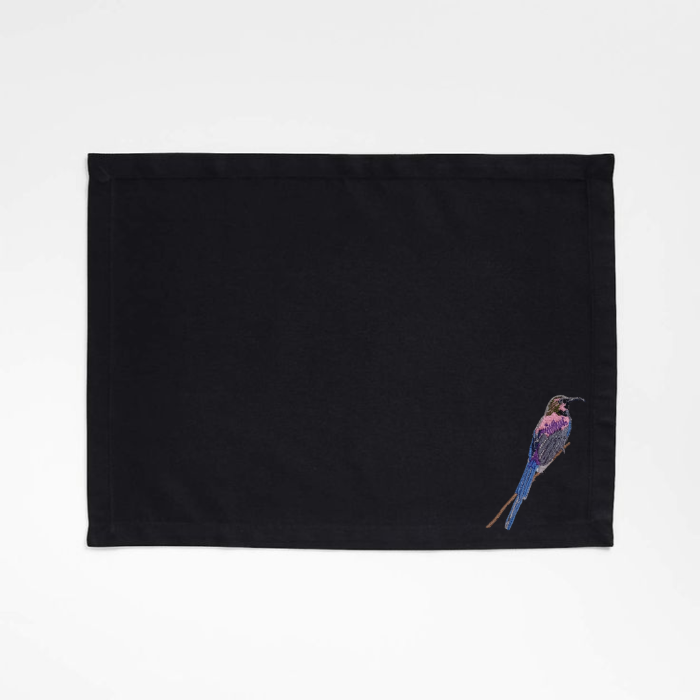 Black embroidered  Tablemat with bird embroidery on a white background