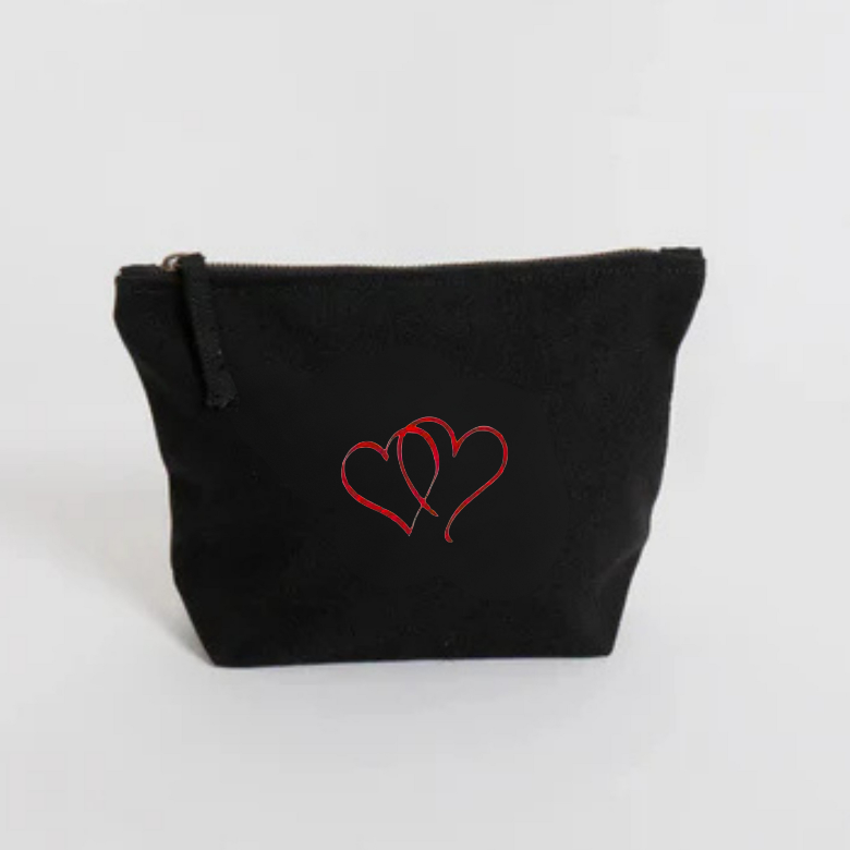 Black pouch with red heart embroidery  on a white background