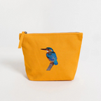 Mustard pouch with a bird design on a white background