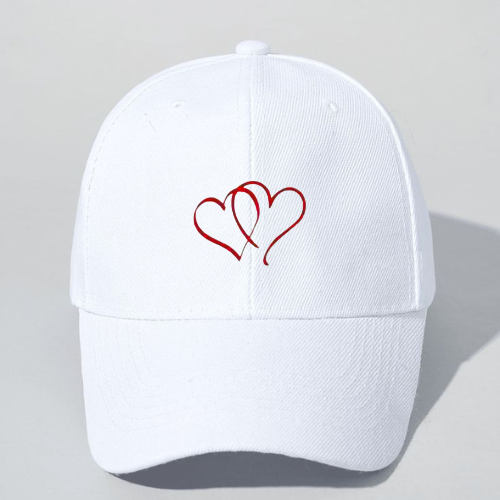 White cap with red heart design on a light gray background