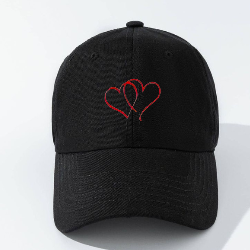 Black cap with red hearts embroidery on a white background
