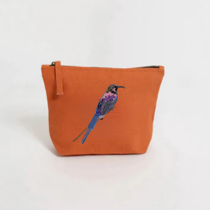 Burnt Orange pouch with a bird Embroidery on a white background