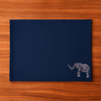 Navy blue placemat with an elephant embroidery design