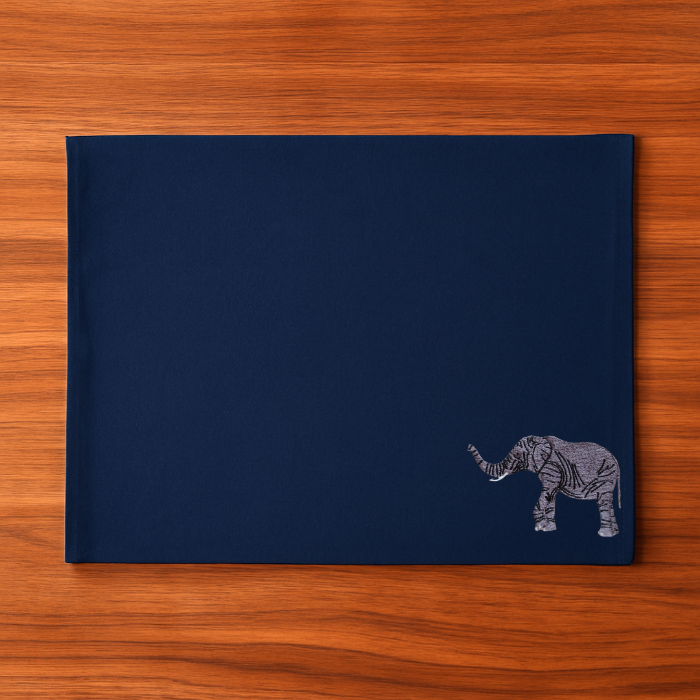 Navy blue placemat with an elephant embroidery design