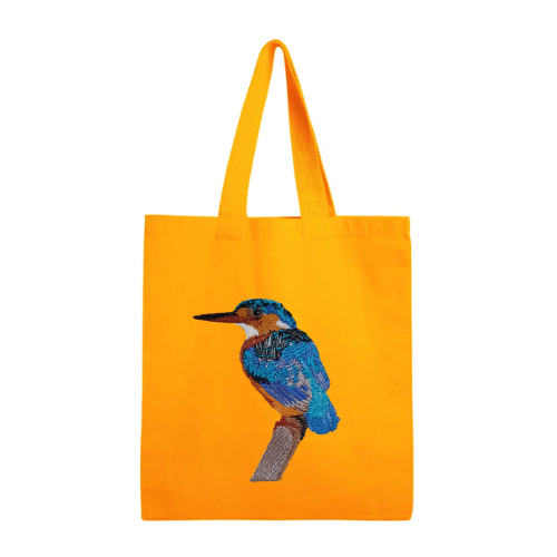 Mustard tote bag with a blue bird design on a white background