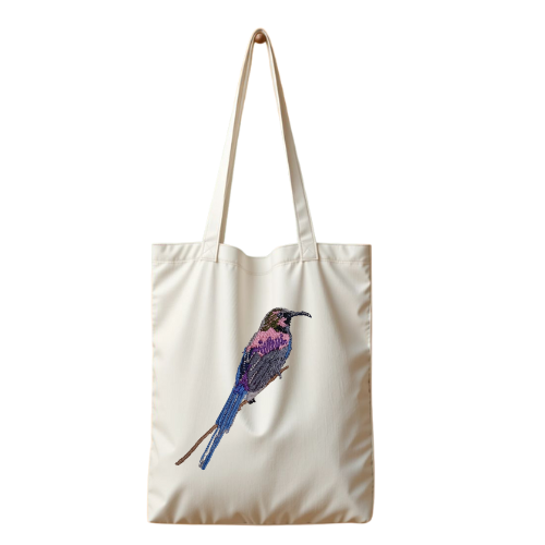 Tote bag with a bird embroidery on a white background