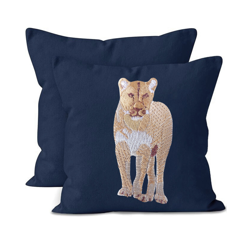 Navy blue cushion cover with a embroidered lion design on a white background