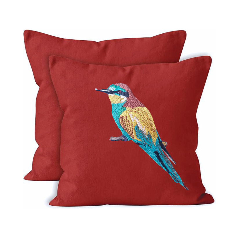 Red canvas cushion cover with embroidered bird design 