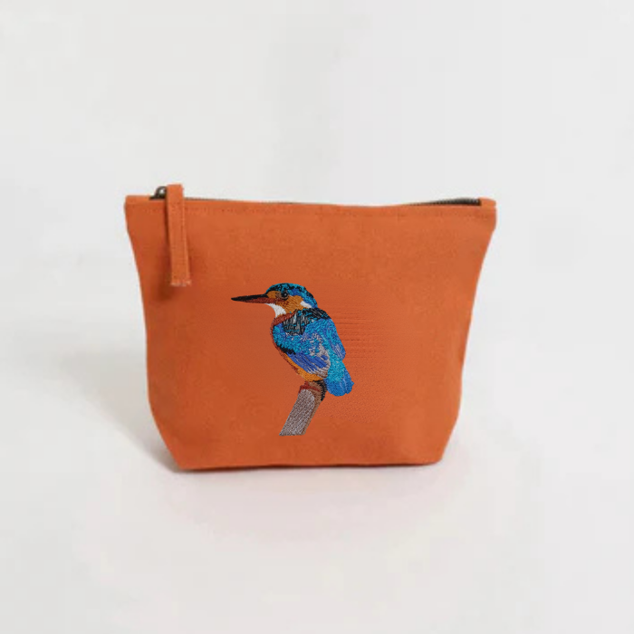  Burnt Orange pouch with a  bird embroidery on a white background