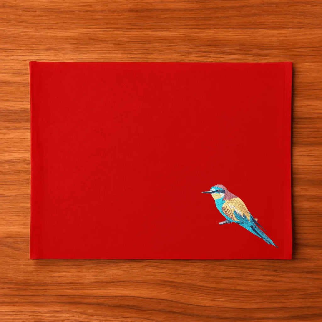 Handmade Ilisah Bee Eater Embroidery table mats in navy blue, set of 4, made from 100% cotton canvas for stylish dining.