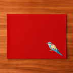 Handmade Ilisah Bee Eater Embroidery table mats in navy blue, set of 4, made from 100% cotton canvas for stylish dining.