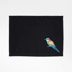 Handmade Ilisah Bee Eater Embroidery table mats in navy blue, set of 4, made from 100% cotton canvas for stylish dining.