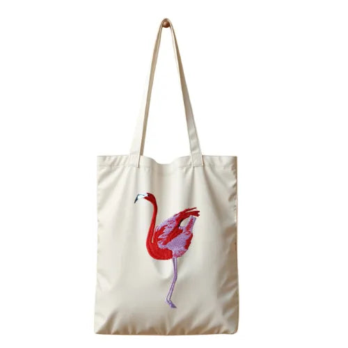 Canvas Tote in Flamingo by ILISAH, featuring a vibrant pink flamingo design on durable 100% cotton canvas, perfect for eve...