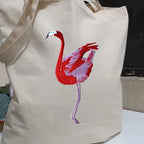 Canvas Tote in Flamingo by ILISAH, featuring a vibrant pink flamingo design on durable 100% cotton canvas, perfect for eve...