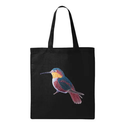ILISAH Canvas Tote featuring a vibrant hummingbird design, available in black, burnt orange, and navy blue, perfect for ev...