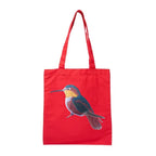 ILISAH Canvas Tote featuring a vibrant hummingbird design, available in black, burnt orange, and navy blue, perfect for ev...