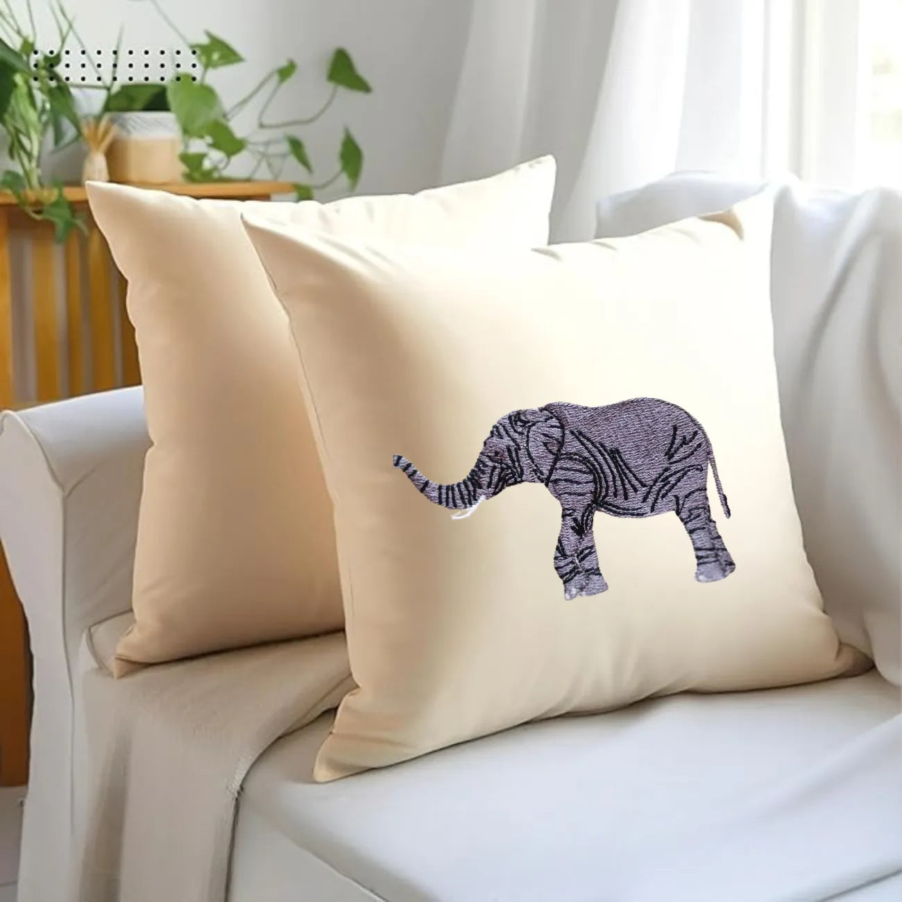 Handmade ILISAH elephant embroidery cushion covers in beige and white, perfect for chairs and sofas, adding charm to any s...
