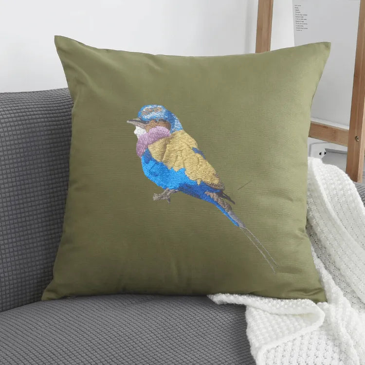 Handmade ILISAH lilac-breasted roller embroidered cushion cover in vibrant colors, perfect for refreshing your couch or bed.