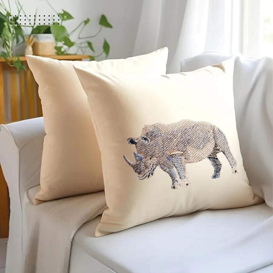 Handmade ILISAH Rhino Embroidery cushion covers in beige and white, perfect for refreshing chairs and sofas with artisan c...