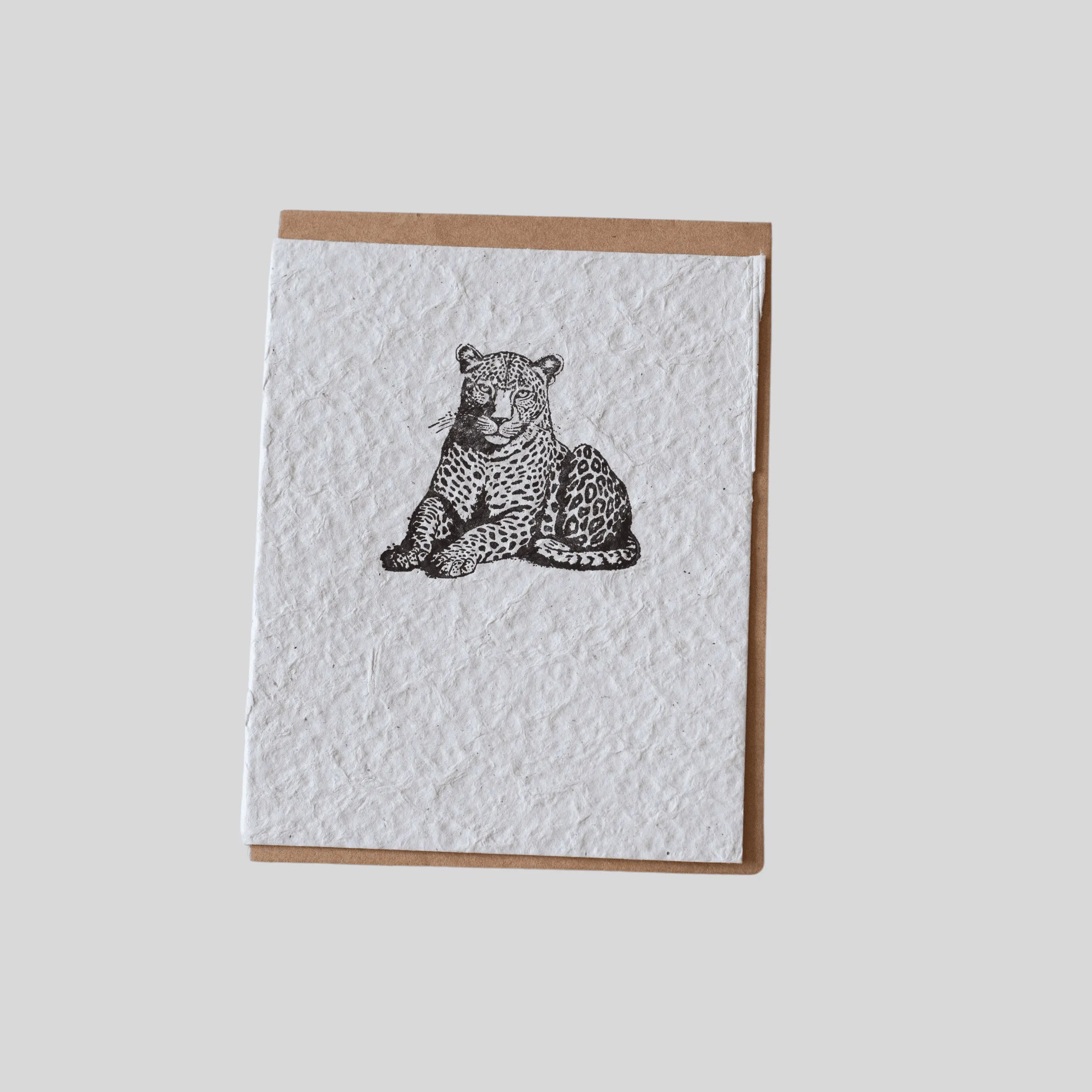 Handmade eco-friendly leopard greeting card by ILISAH, featuring unique recycled water hyacinth paper, perfect for gifting.