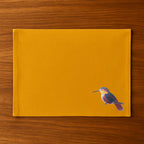 Handmade rectangular table mats with Humming Bird embroidery by Ilisah, available in mustard, burnt orange, and beige whit...