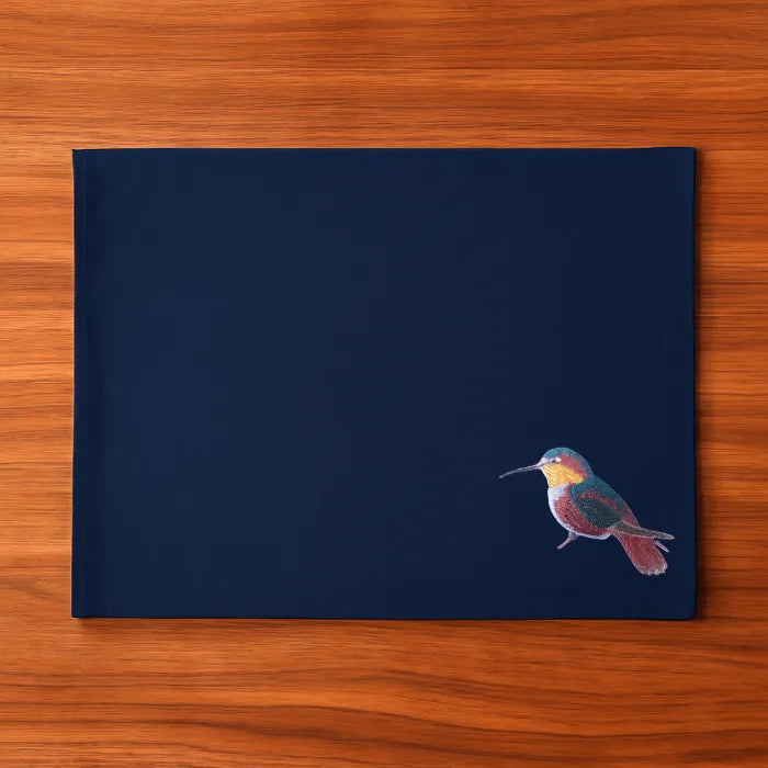 Handmade rectangular table mats with Humming Bird embroidery by Ilisah, available in mustard, burnt orange, and beige whit...