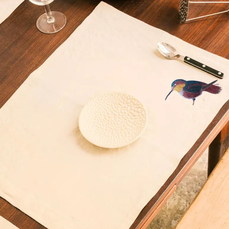 Handmade rectangular table mats with Humming Bird embroidery by Ilisah, available in mustard, burnt orange, and beige whit...