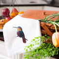 Embroidered kitchen towels by Ilisah featuring colorful hummingbirds, crafted from 100% cotton, perfect for your kitchen d...