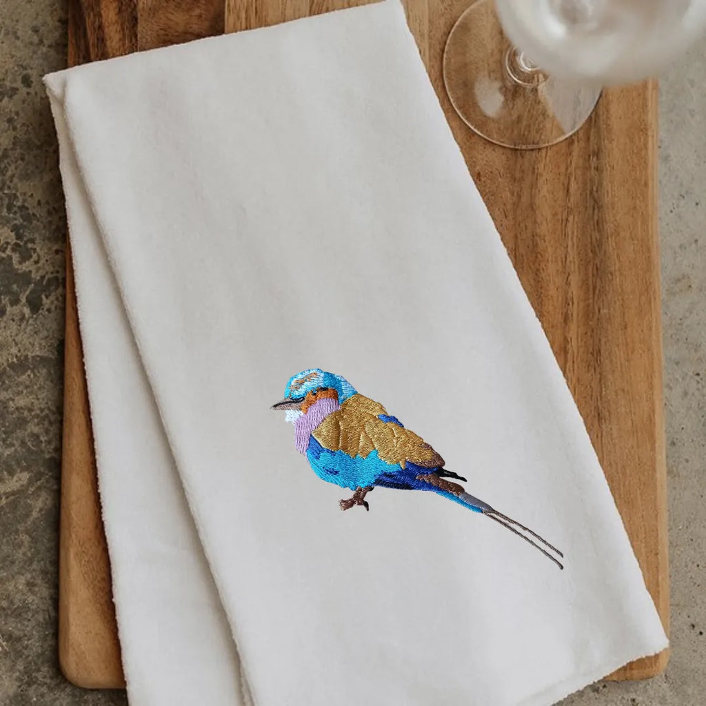 Lilac Breasted Roller embroidered kitchen towels by Ilisah, 100% cotton, showcasing vibrant bird designs, perfect for your...
