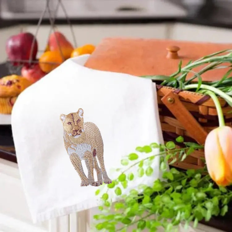Ilisah kitchen towels featuring lion embroidery, crafted from 100% cotton, showcasing vibrant colors and intricate designs.