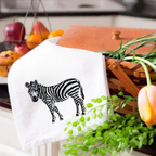 Ilisah kitchen towels with zebra embroidery, crafted from 100% cotton, showcasing vibrant animal designs, perfect for your...