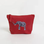 Handmade ILISAH Elephant Make Up Pouch in Burnt Orange, a compact canvas organizer for makeup and travel essentials.