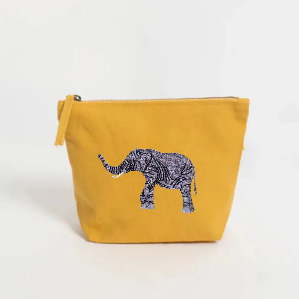Handmade ILISAH Elephant Make Up Pouch in Burnt Orange, a compact canvas organizer for makeup and travel essentials.
