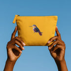 Handmade ILISAH Humming Bird canvas makeup pouch in mustard, perfect for organizing everyday essentials and travel items.