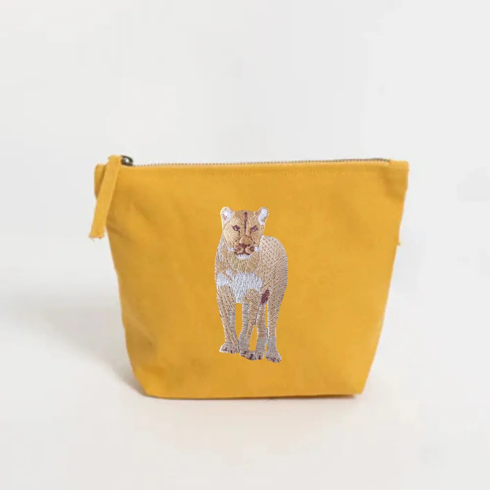 Handmade ILISAH Lion Make Up Pouch in Burnt Orange, a compact canvas bag for organizing makeup and essentials.