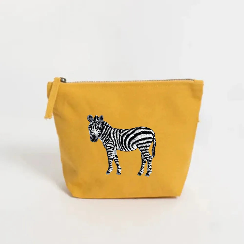 Handmade ILISAH Zebra Make Up Pouch in white canvas, perfect for organizing makeup and essentials, ideal for travel or eve...