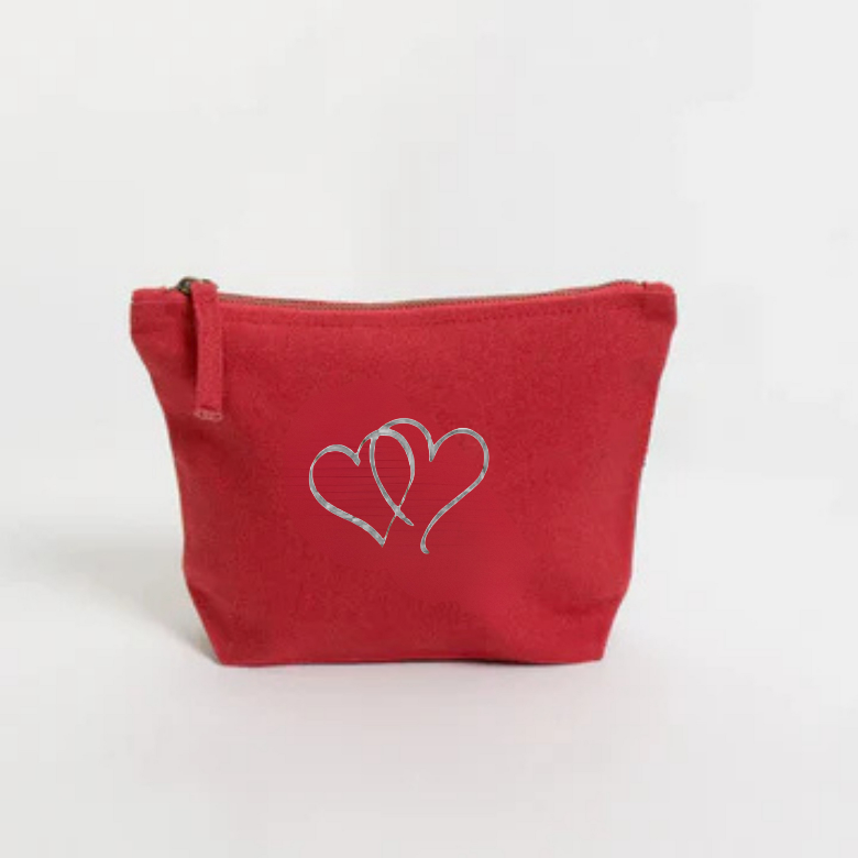 Red pouch with two white hearts  embroidery on a white background