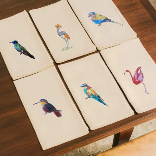 Handmade Ilisah napkins with Bee Eater embroidery, set of 4 in beige white, perfect for dining and table decor.