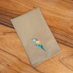 Handmade Ilisah napkins with Bee Eater embroidery, set of 4 in beige white, perfect for dining and table decor.