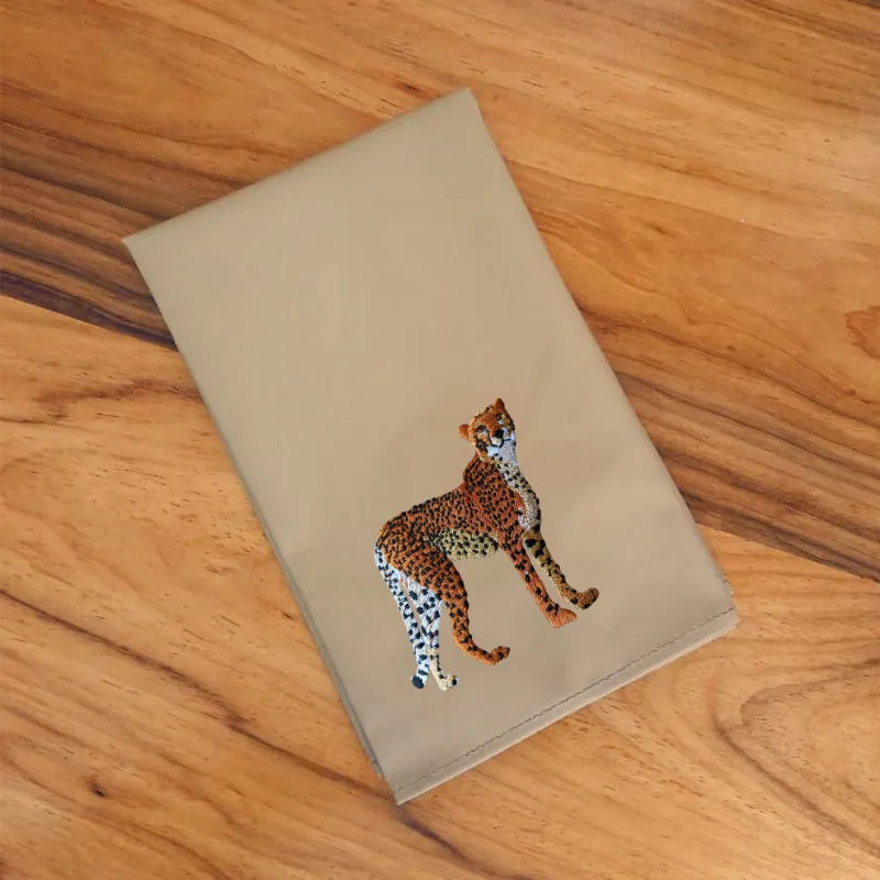 Handmade Ilisah napkins with cheetah embroidery, set of 4 in brown khaki, perfect for dining and special gatherings.