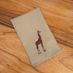 Handmade Ilisah napkins with giraffe embroidery in beige and white, set of 4, perfect for dining and table decor.