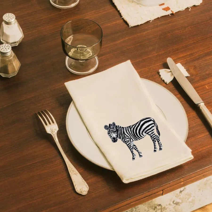 Handmade Ilisah napkins with zebra embroidery, available in Brown Khaki or Beige White, set of 4 or 6, perfect for dining.