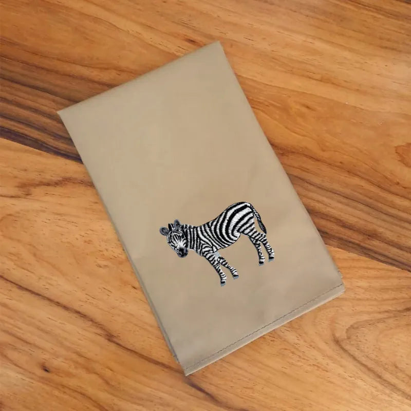 Handmade Ilisah napkins with zebra embroidery, available in Brown Khaki or Beige White, set of 4 or 6, perfect for dining.