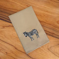 Handmade Ilisah napkins with zebra embroidery, available in Brown Khaki or Beige White, set of 4 or 6, perfect for dining.