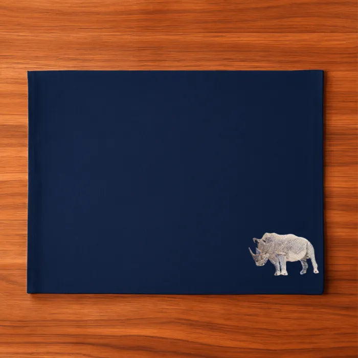 Handmade Rhino Embroidery table mats by Ilisah, set of 4 in white, durable cotton canvas, perfect for dining decor.