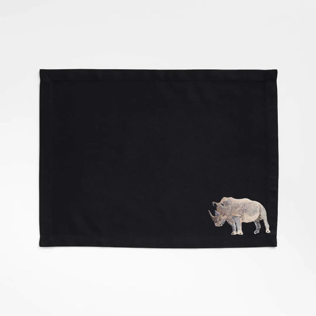 Handmade Rhino Embroidery table mats by Ilisah, set of 4 in white, durable cotton canvas, perfect for dining decor.