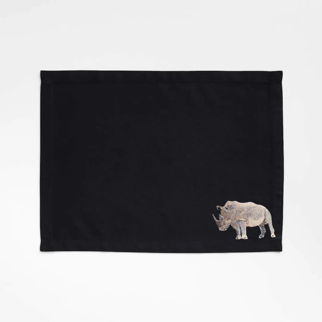 Handmade Rhino Embroidery table mats by Ilisah, set of 4 in white, durable cotton canvas, perfect for dining decor.