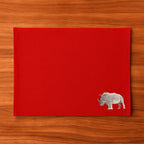 Handmade Rhino Embroidery table mats by Ilisah, set of 4 in white, durable cotton canvas, perfect for dining decor.