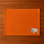 Handmade Rhino Embroidery table mats by Ilisah, set of 4 in white, durable cotton canvas, perfect for dining decor.